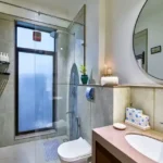 4 BHK Villa Saral Alibaug Bathroom with Glass-Enclosed Shower