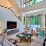 4 BHK Villa Saral Alibaug Double-Height Living Room with Pool View