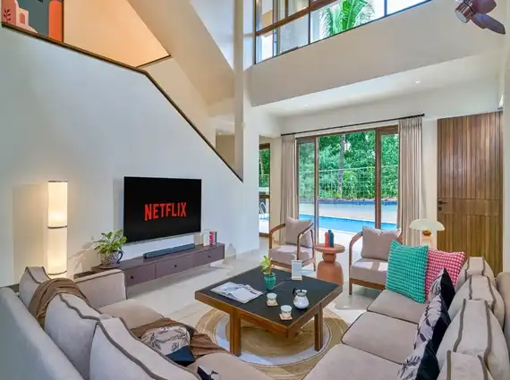 4 BHK Villa Saral Alibaug Double-Height Living Room with Pool View