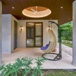 4 BHK Villa Saral Alibaug Front Porch with Hanging Egg Chair