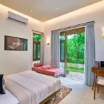 4 BHK Villa Saral Alibaug Ground-Floor Bedroom with Garden View
