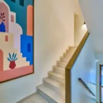 4 BHK Villa Saral Alibaug Indoor Staircase with Colorful Wall Art