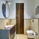 4 BHK Villa Saral Alibaug Modern Bathroom with Vanity and Toilet