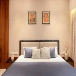 5 BHK Villa Karle Riverville Benaulim Goa Bedroom With Upholstered Bed And Wooden Wall