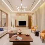 5 BHK Villa Karle Riverville Benaulim Goa Living Room With TV And Mustard Armchairs