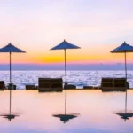 Lotus Aquaria Prabhadevi Umbrella Chairs Beside Infinity Swimming Pool on Terrace