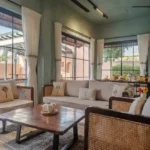 3 BHK Villa Kihim Alibaug Living Room With Sofa And Cane Chairs