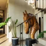 5 BHK Villa Isprava Valoria Alibaug Staircase With Horse Sculpture