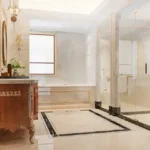 The Address by GS Sion White Bathroom with Glass Shower