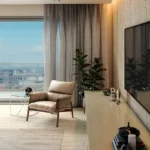 3 BHK Eirene Heights Dadar Living Room with TV and Armchair