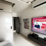 3 BHK Oberoi Exquisite Goregaon Bedroom with TV and White Wardrobe