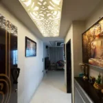 3 BHK Oberoi Exquisite Goregaon Entrance Hallway with Buddha Artwork