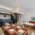 3 BHK Villa Infiniti Bay Dabolim Bogmalo Beach Goa Dining Table with Open Kitchen and Living Room