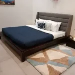 4 BHK Villa Khopoli Bedroom with Blue Bedding and Patterned Rug