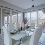 4 BHK Villa Khopoli Dining Room with Glass Doors and Outdoor Views
