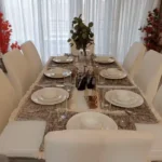 4 BHK Villa Khopoli Dining Table with White Chairs and Place Settings