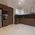 4 BHK Villa Khopoli Kitchen with Wooden Cabinets and Appliances