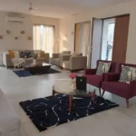 4 BHK Villa Khopoli Living Room with Burgundy Armchairs