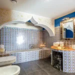 4 BHK Villa Ballad Angela Boheim Siolim Goa Bathroom with Patterned Tiles and Arched Bathtub