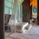 4 BHK Villa Ballad Angela Boheim Siolim Goa Bedroom with Canopy Bed and Upholstered Bench