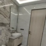 8 BHK Jodi Windsor Grande Andheri West Bathroom With Marble Pattern Walls And Vanity