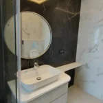 8 BHK Jodi Windsor Grande Andheri West Bathroom With Round Mirror And Vessel Sink
