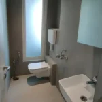 8 BHK Jodi Windsor Grande Andheri West Bathroom With Wall Mounted Toilet And Small Basin