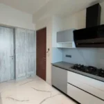 8 BHK Jodi Windsor Grande Andheri West Kitchen With Gas Hob And Black Chimney