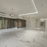 8 BHK Jodi Windsor Grande Andheri West Living Room With Corner Windows And Chandeliers