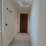 8 BHK Jodi Windsor Grande Andheri West Utility Passage With Window And Wooden Door