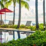 Godrej Bandra Bay Phase 1 Amenities Palm Lined Pool With Red Umbrellas