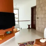 Sanctuary Boheim 3 BHK Villa Siolim Goa Bedroom TV Wall with Floating Shelf
