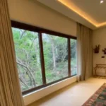 Sanctuary Boheim 3 BHK Villa Siolim Goa Bedroom Window with Lush Green Views