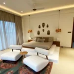 Sanctuary Boheim 3 BHK Villa Siolim Goa Bedroom with Upholstered Bed and Lounge Chairs