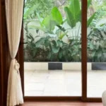 Sanctuary Boheim 3 BHK Villa Siolim Goa Garden View Through Sliding Glass Doors