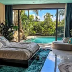 Taj Mount Kusur Villas Resort Bedroom with Teal Curtains and Pool View