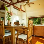 Taj Mount Kusur Villas Resort Dining Room with Wooden Table and Chairs