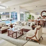Taj Mount Kusur Villas Resort Poolside Living and Dining Room with Wooden Furniture