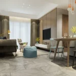 2 BHK The Altimus Khar West Cozy Combined Lounge With Grey Tile Floor Teal Pouf And Bulb Pendant Lights