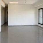 3 BHK Amaris Park Matunga East Roomy Entrance Hall With Glossy Floor Leading Toward Bedroom Corridor