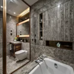 3 BHK Asmi Legacy Unnat Nagar Goregaon Luxury Washroom With Full Grey Stone Cladding And Soaking Tub