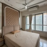 3 BHK Kalpataru Radiance Goregaon Soft Taupe Sleeping Suite With Diamond Quilted Panel Tall Mirror