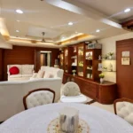 4 BHK Cannon Bandra West Elegant Eating Zone With Tufted Chairs Wooden Showcase