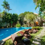 4 BHK Isprava Villa Viastro Pernem Goa Garden Pool with Sun Loungers and Stone Path