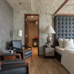 4 BHK Penthouse Bharat Skyvistas DN Nagar Andheri West Bedroom With Armchairs And Four Poster Bed