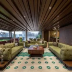 4 BHK Penthouse Bharat Skyvistas DN Nagar Andheri West Entertainment Lounge With Green Sofas