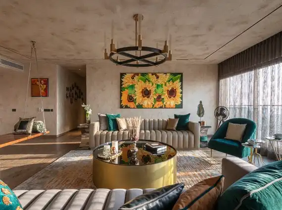 4 BHK Penthouse Bharat Skyvistas DN Nagar Andheri West Living Room With Sofas And Floral Artwork