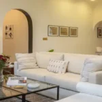 4.5 BHK Isprava Lumosa Aldona Goa Living Room With White Sofa And Glass Coffee Table