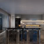 5 BHK The Grand Lower Parel Sleek Cooking Area With Glossy Dining Counter Backlit Backsplash