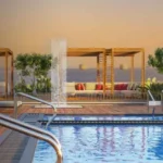 Baya Sunrise Dadar Rooftop Swimming Pool With Rain Shower Feature, Wooden Pergola Cabanas Golden Sunset Sky Views